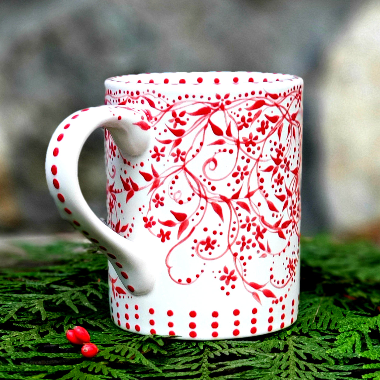 Hand painted red and white mug with darling polka dots and vines. A soft satin glaze that feels so good