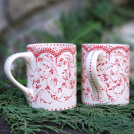 Hand painted red and white mug with darling polka dots and vines. A soft satin glaze that feels so good ... 16 oz. ceramic mug