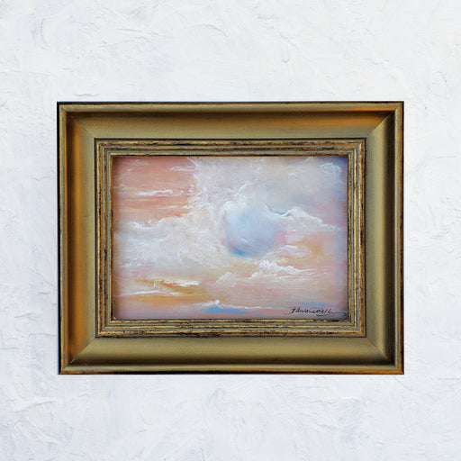 Original oil painting of dreamy clouds with the sun just coming up...Bright and dreamy with blues and golds and pinks ..5x7 oil painting framed in vintage style gold frame