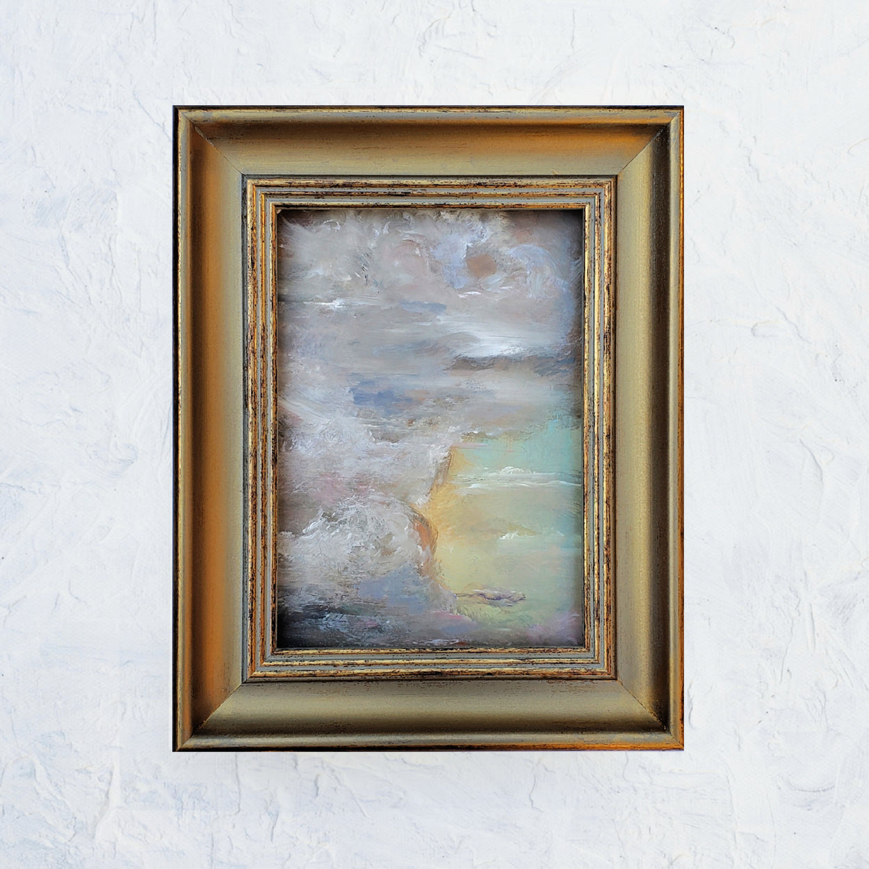 Vintage style frame with vintage looking clouds in soft warm colors and glowing with gold and aqua... 5x7 original oil painting