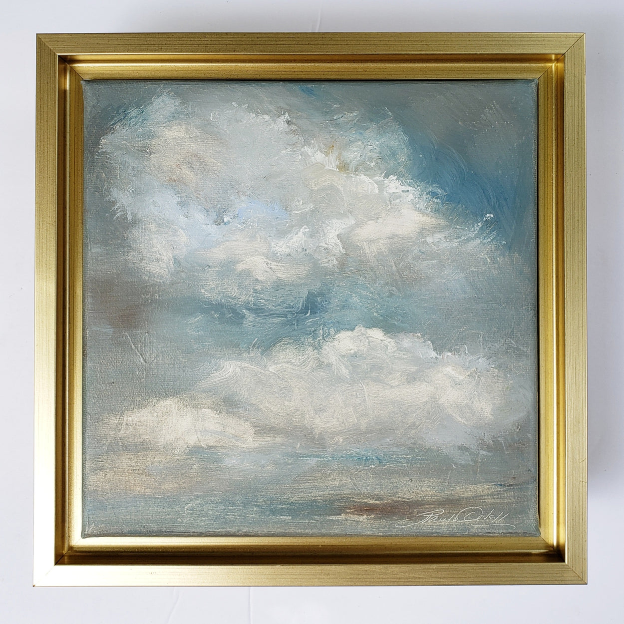 Original oil painting on canvas...Beautiful puffy clouds floating in a dream like cerulean sky. Framed in a gold wood frame ..will arrive wired and ready to hang.