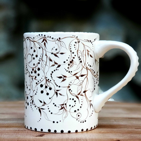This hand painted brown and white mug has such a cozy feel to it. A hot cuppa would just be perfect! Brown vines and tiny berries swirl all around the mug. And the soft satin glaze feels soooo good! 16 oz kiln fired ceramic mug