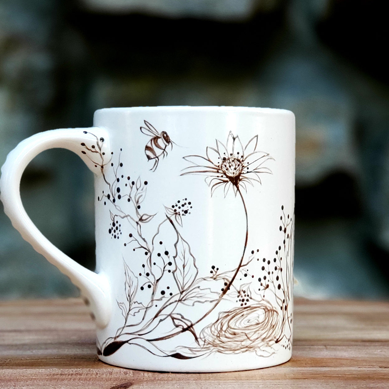 Hand painted woodland design mug.. original design with fox and birds nest and bees and butterflies fluttering about in a whimsical scene that covers this beautiful piece. 16 oz kiln fired mug with satin glaze