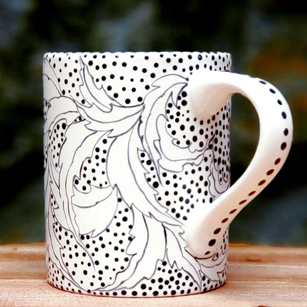 16 oz. kiln fired ceramic mug ... black and white hand painted in a beautiful botanical all over design.