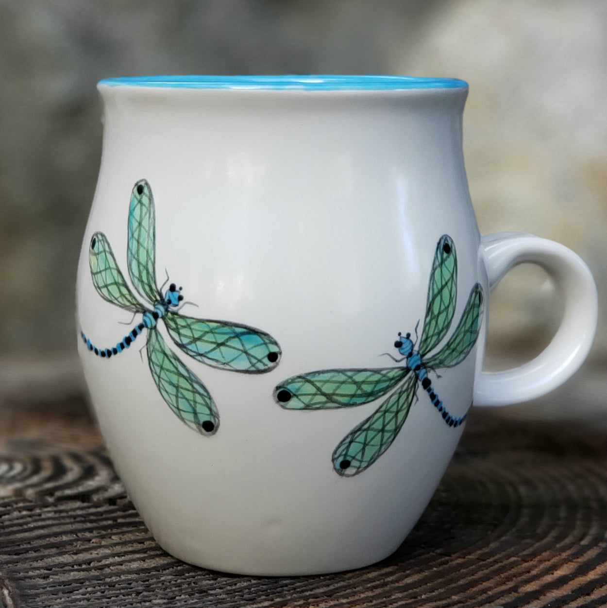Hand painted mug with Dragonflies swirling around the mug. The inside is glazed in a beautiful bright aqua... 16 oz