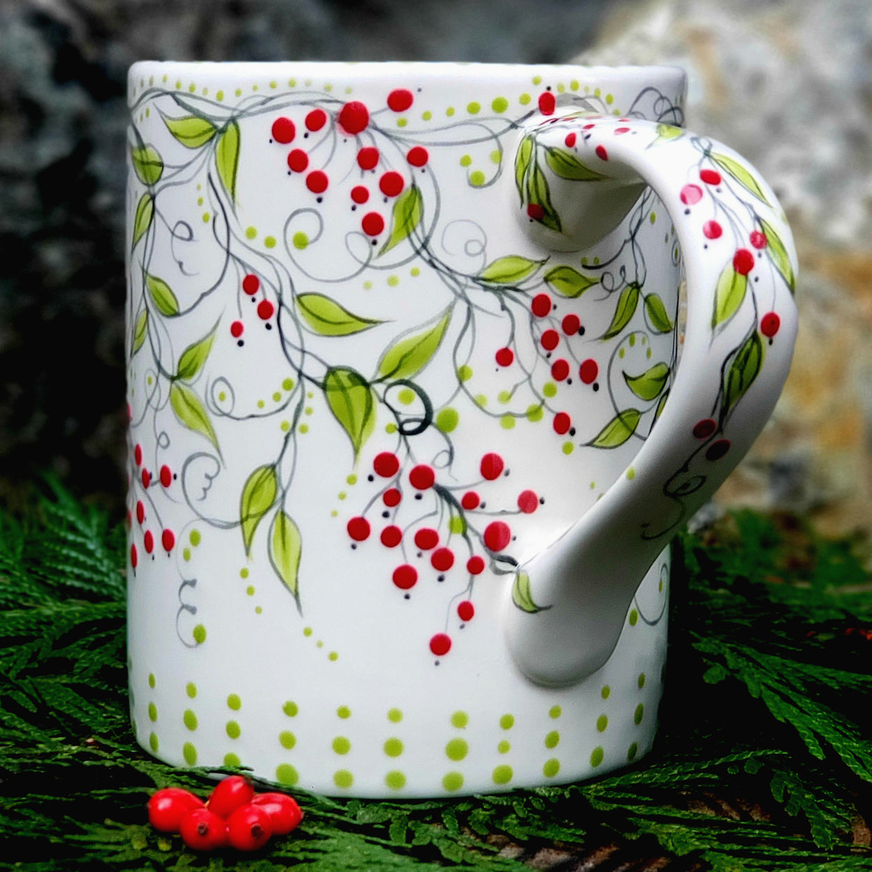 Hand painted red berry mug... with dark green vines and lime colored leaves this satin glazed mug is beautiful! 16 oz. kiln fired ceramic mug