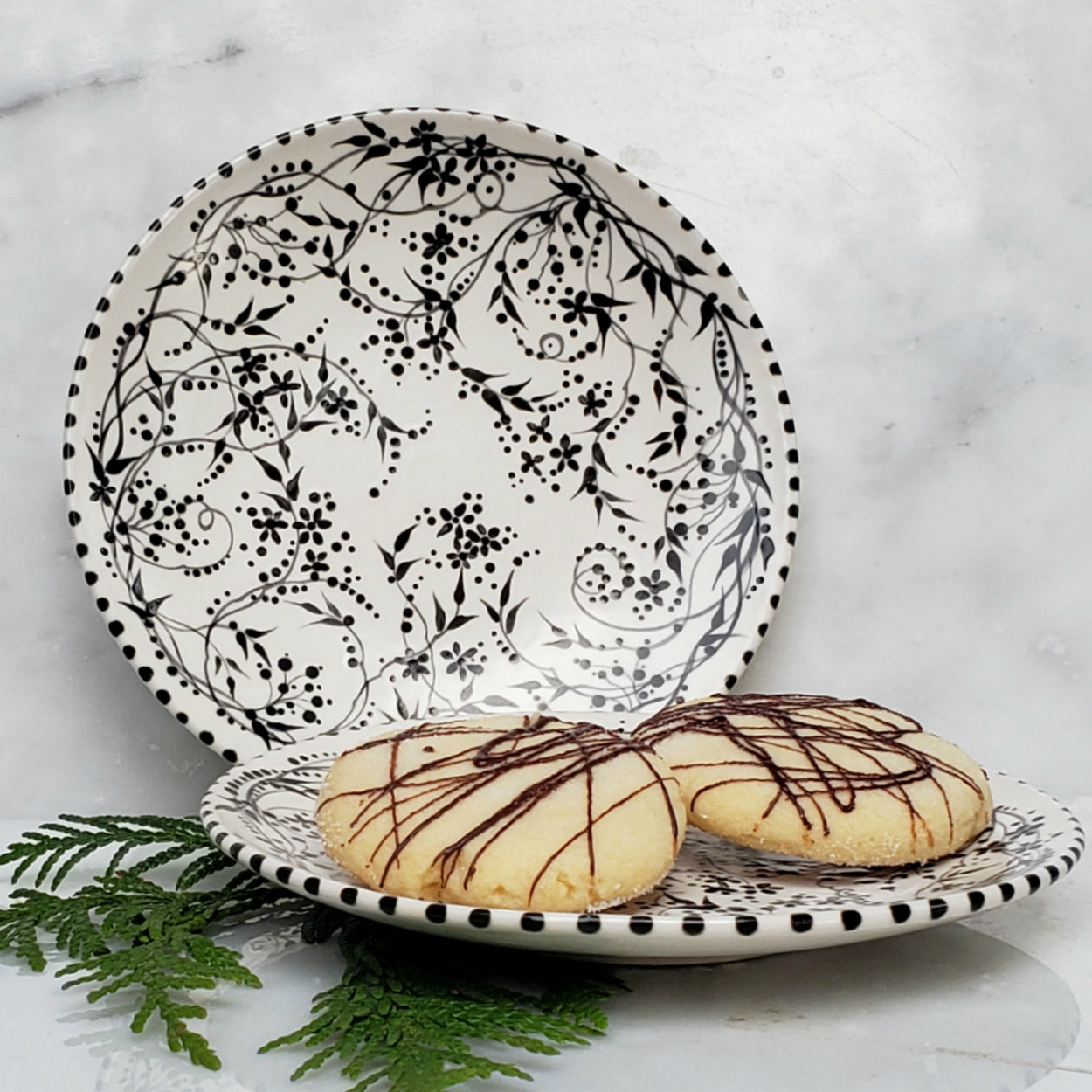6" hand painted black and white desert plate with teeny trailing vines and sweet flowers and polka dots.