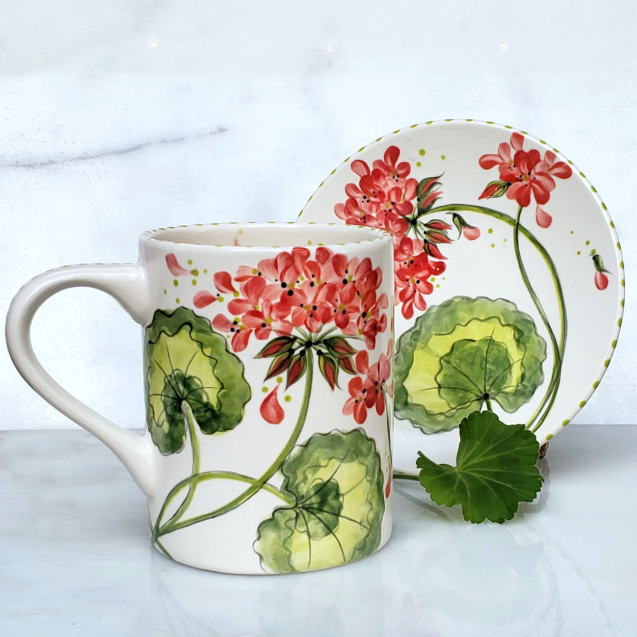Hand Painted Geranium Mug and Dessert Plate.. beautiful peachy and red Geraniums and lime green accents make this set adorable!!! Kiln fired 