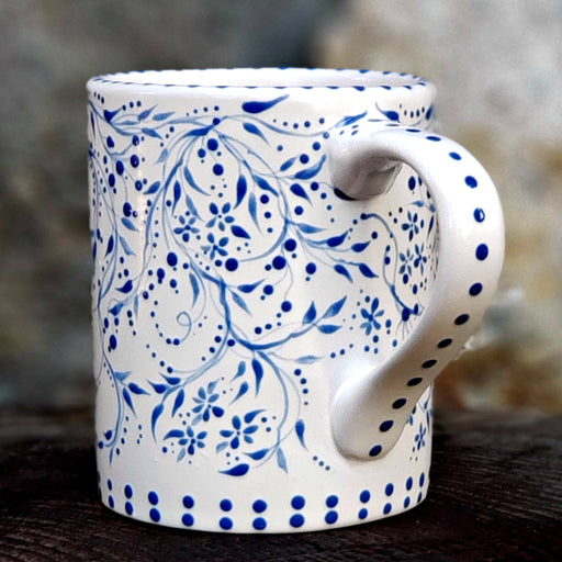Hand Painted mug with a sweet all all over design reminiscent of vintage dishes. Blue and White berries, vines, tiny flowers and a satin glaze. 16 oz. kiln fired ceramic mug 